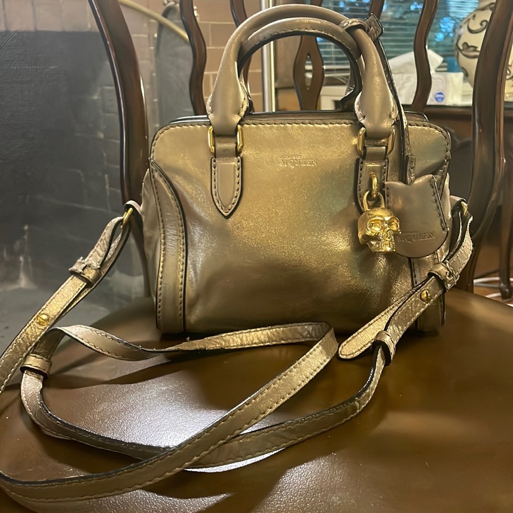 ALEXANDER MCQUEEN. Gold leather mini skull padlock bag. Crossbody & top handle.